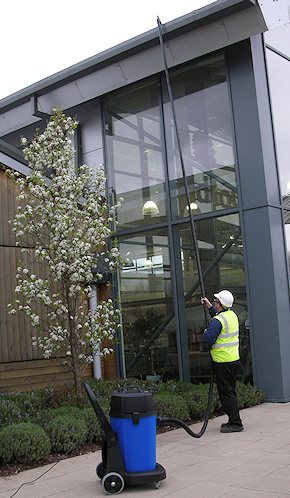 Vacuum cleaning gutters for commercial customers in Reigate